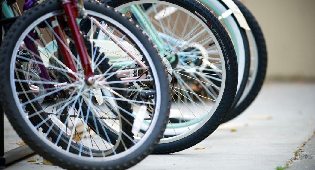 the front tires of a row of bicycles